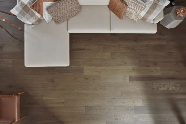 wide plank hardwood flooring with premium look and affordable pricing in modern living room with natural light